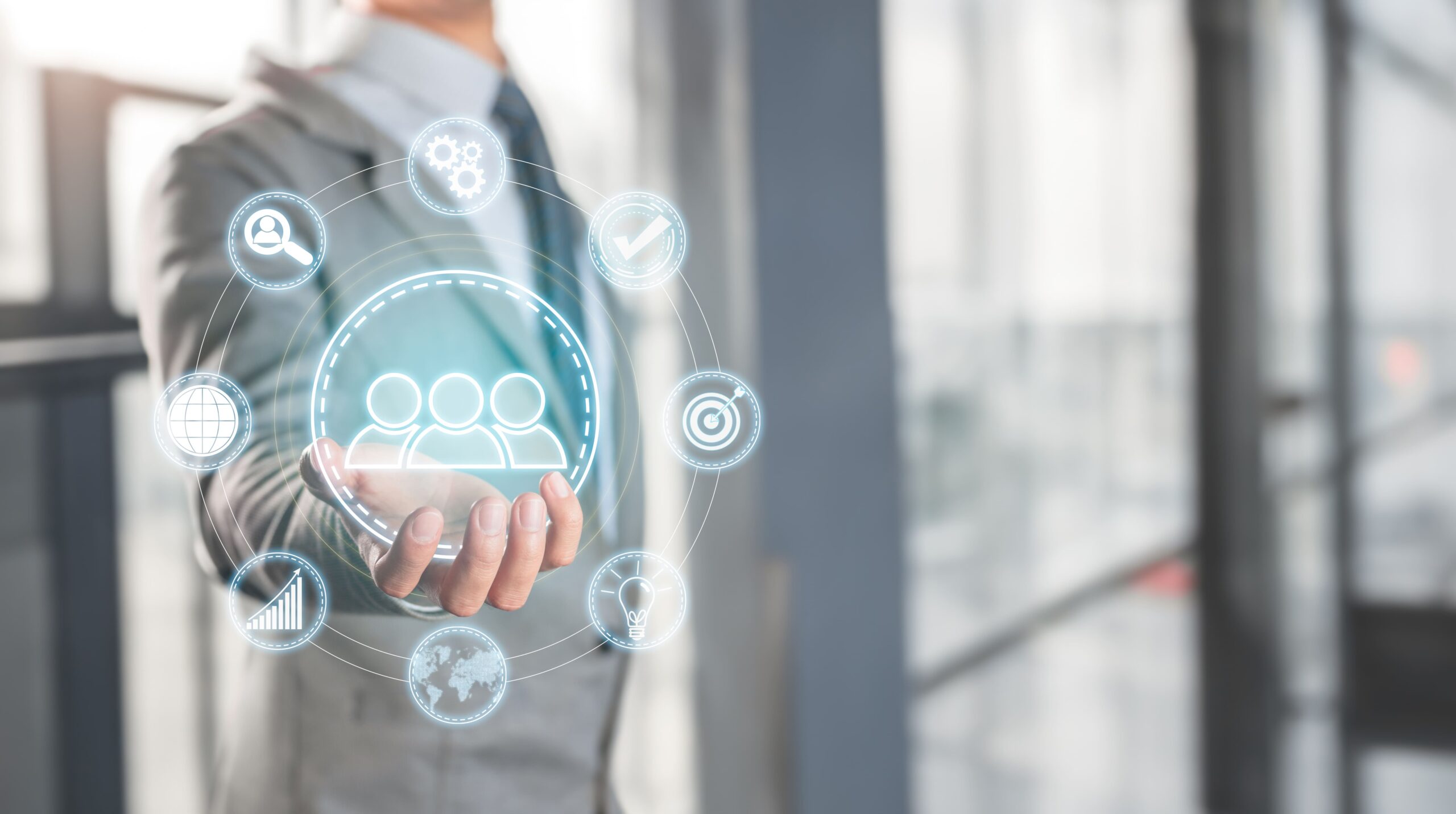 a person holding a circle with icons around them