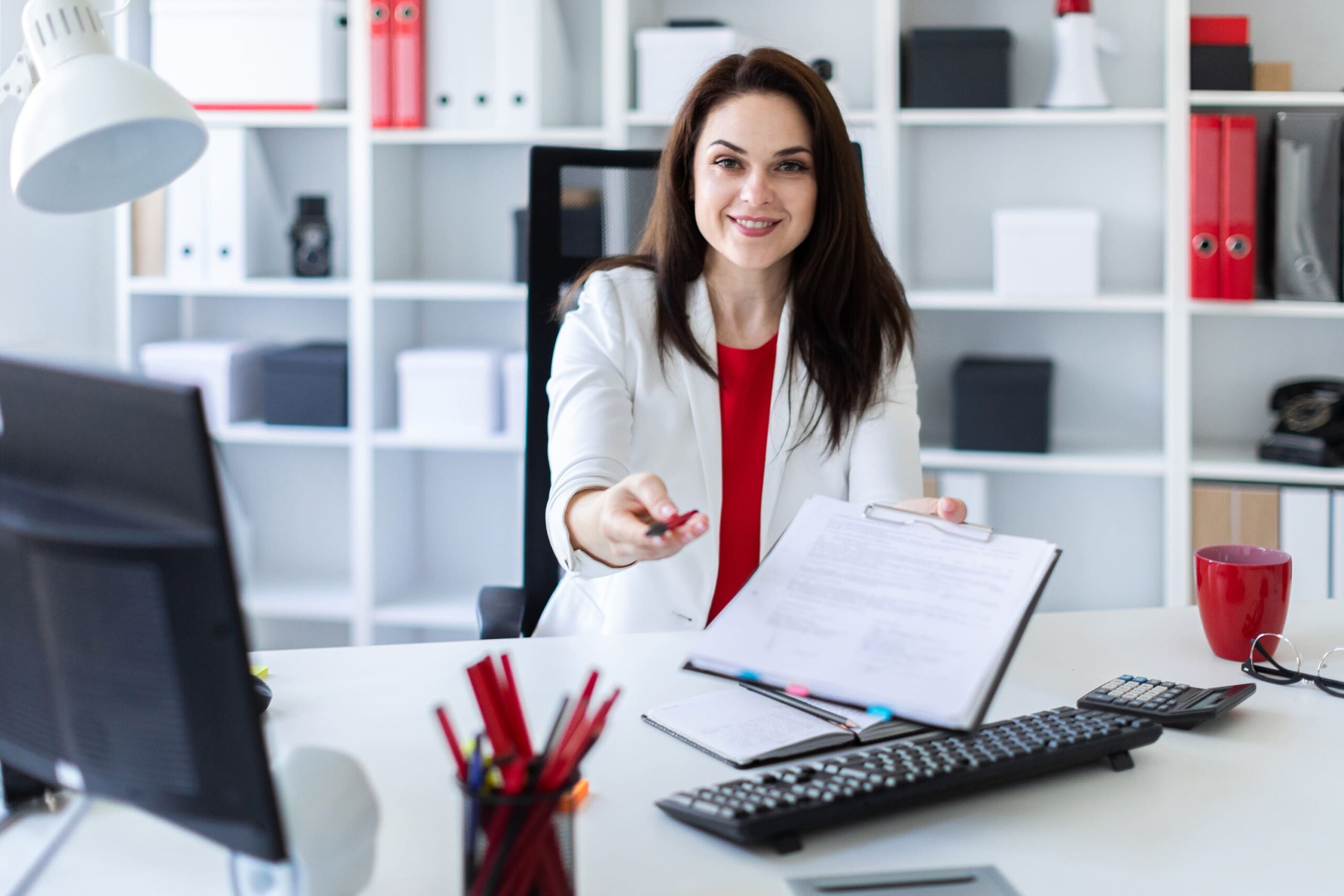 a woman sitting at a desk
