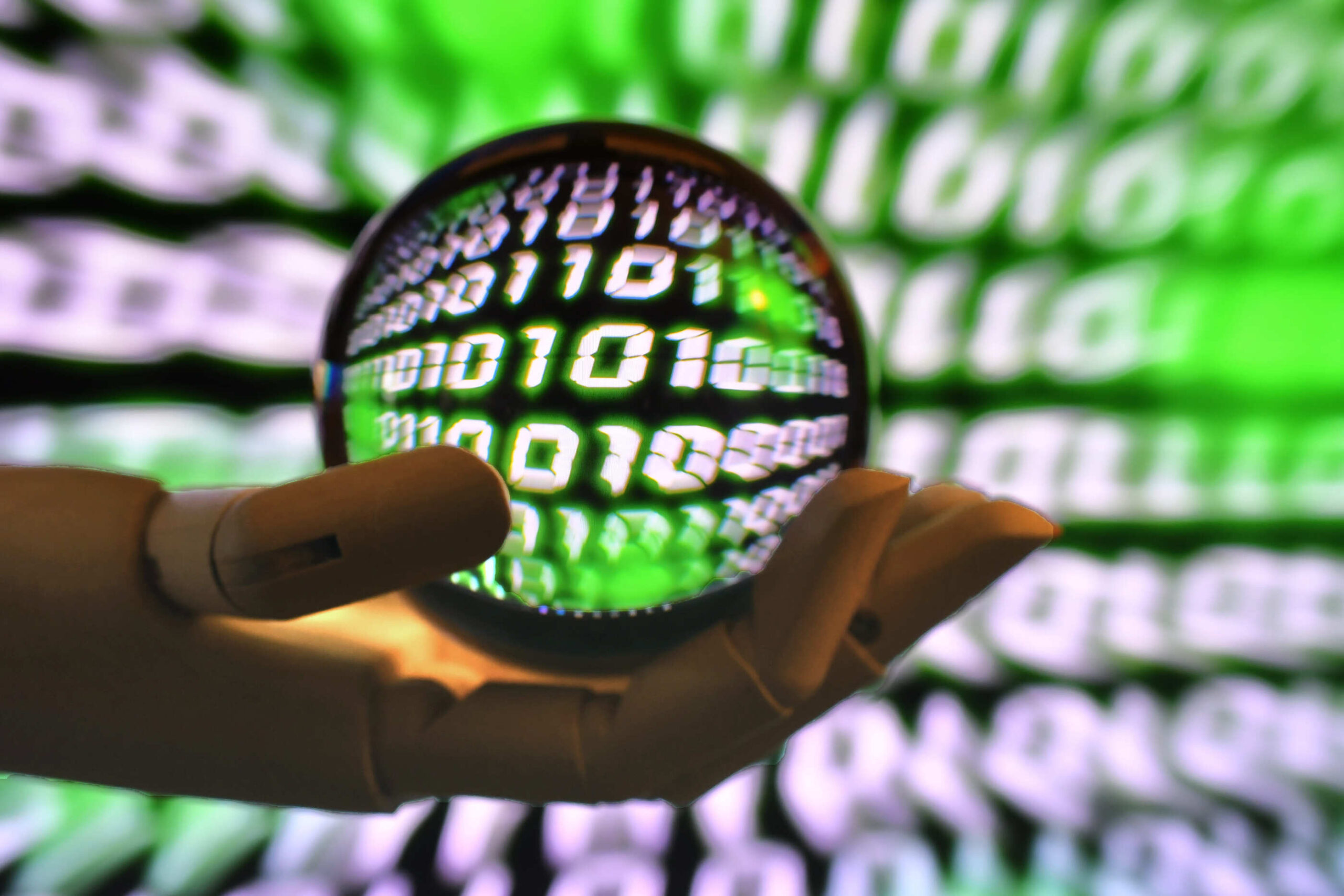 a hand holding a sphere with numbers on it