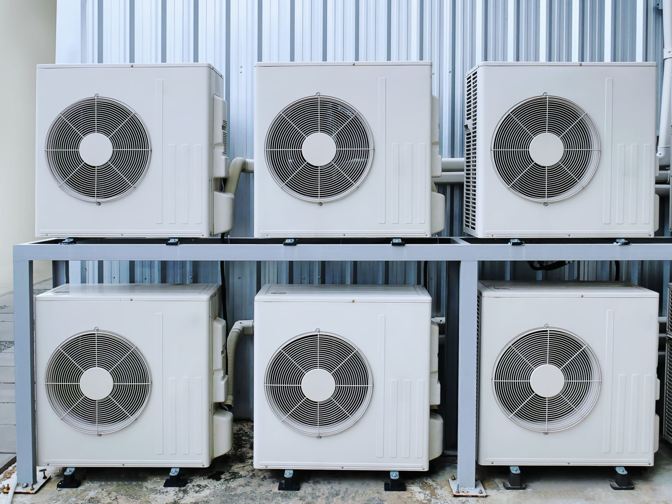 a group of white air conditioning units