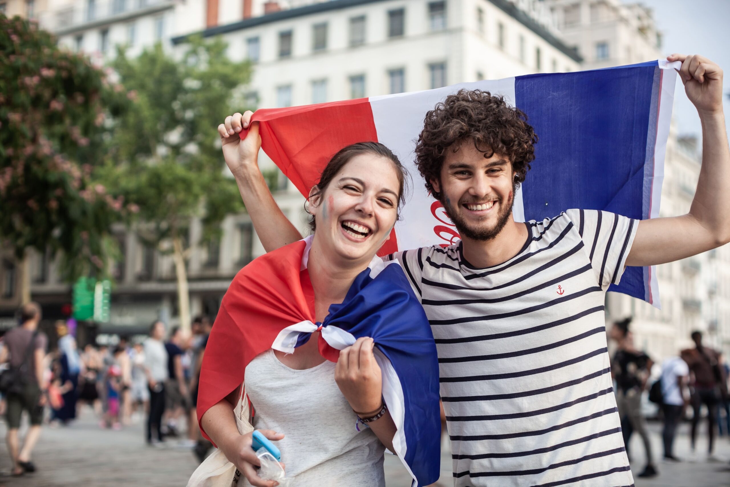 a man and woman holding a flag