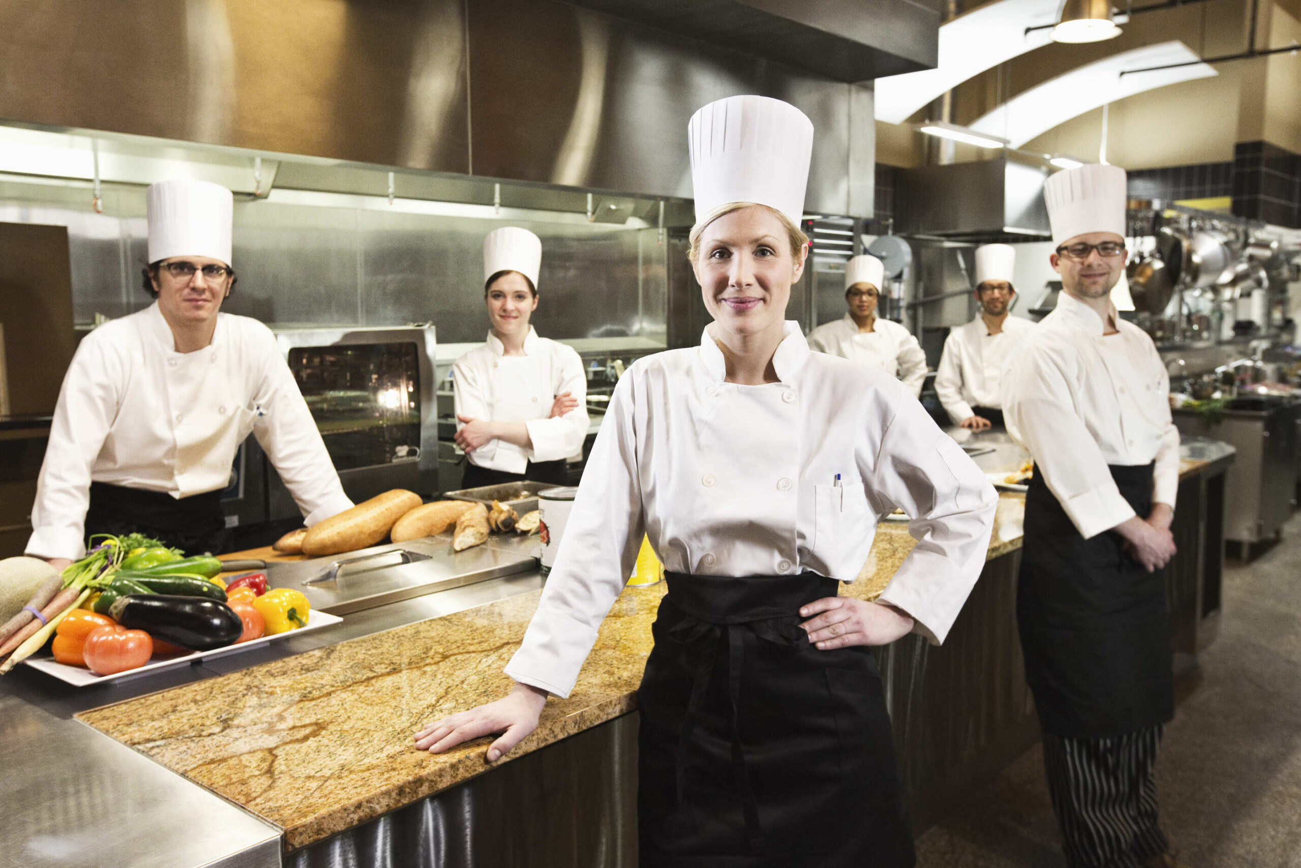 a group of chefs in a kitchen