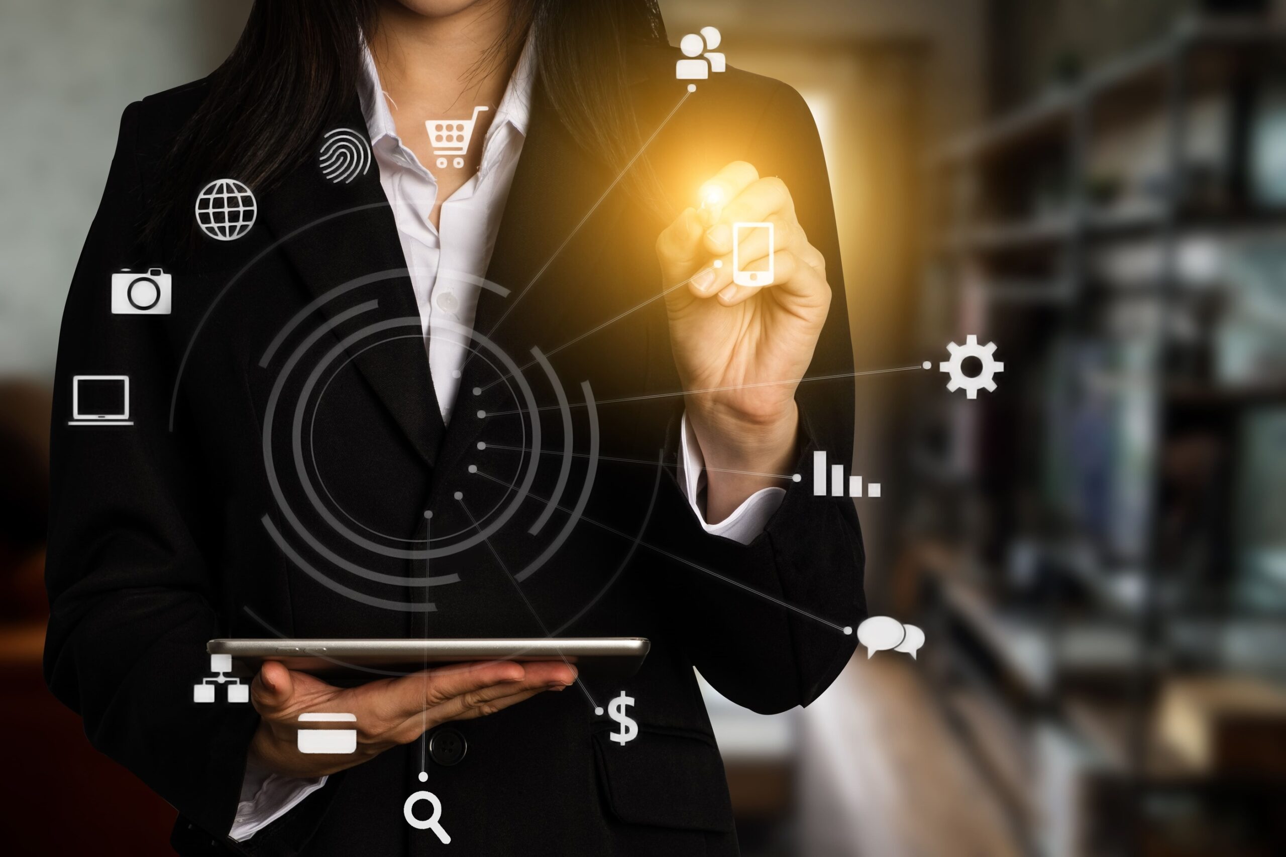 a woman holding a tablet and touching a screen